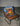VTILTED Desires blue tee with UFO graphic draped over a leather chair